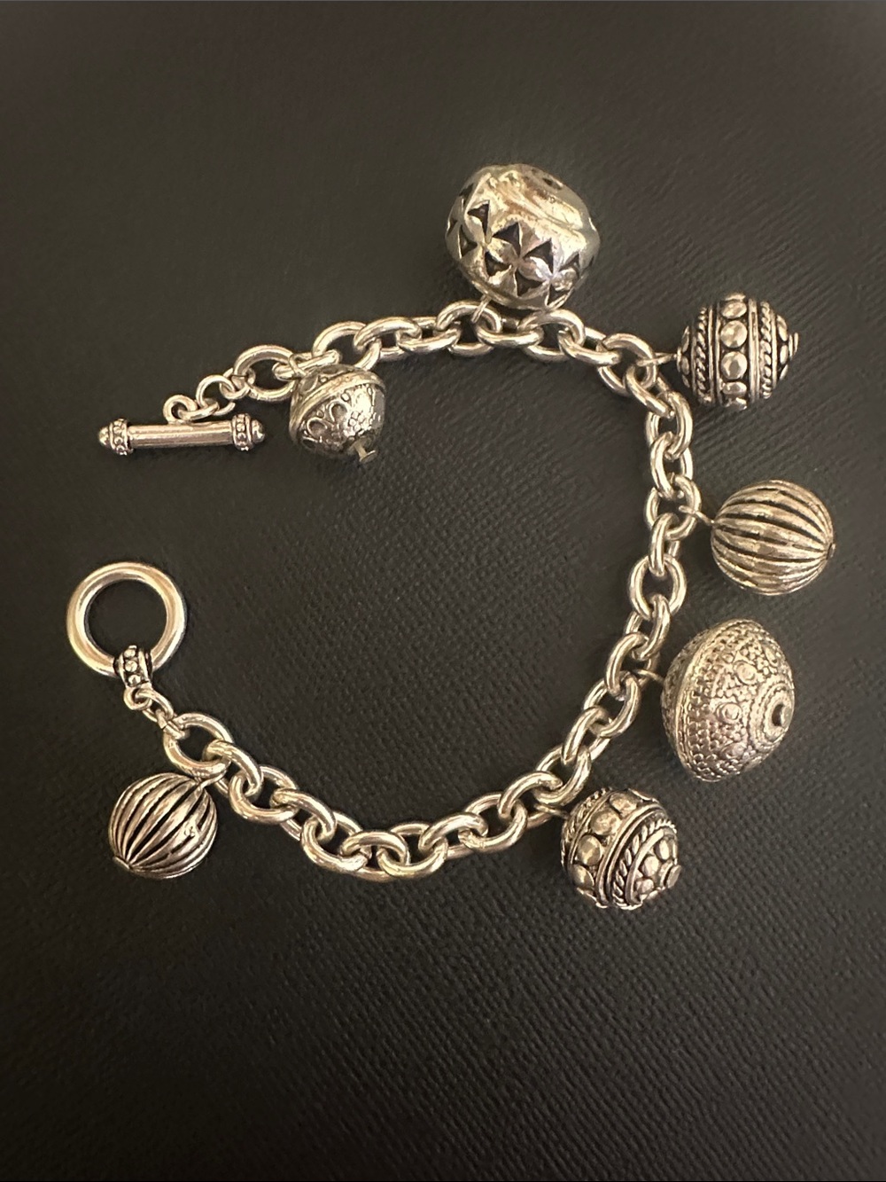 Silver Toned Charm Bracelet with Textured Bead Charms